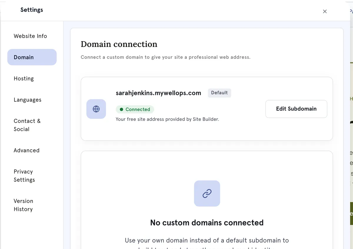 The Domain settings: the free mywellops.com address, and where a custom domain is connected.